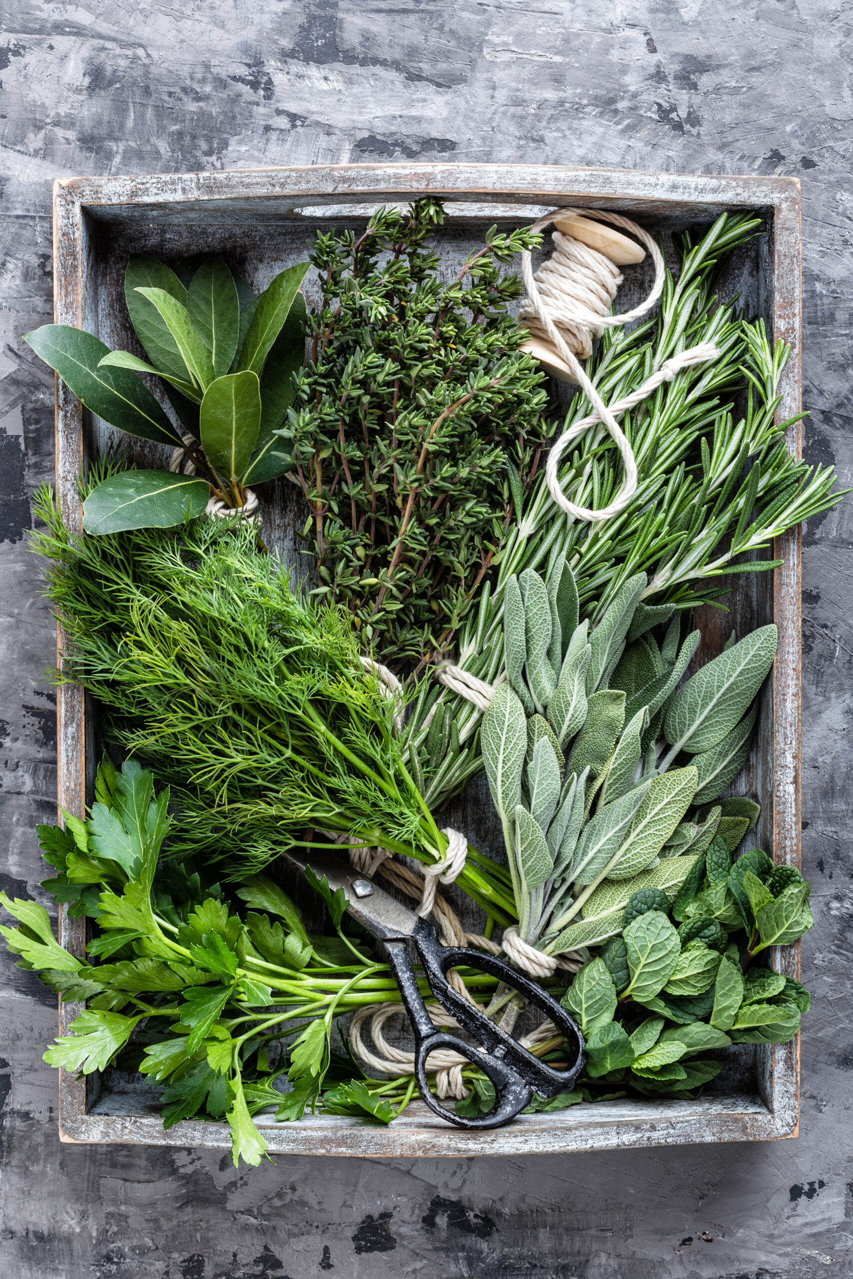 fresh herbs in a wooden box